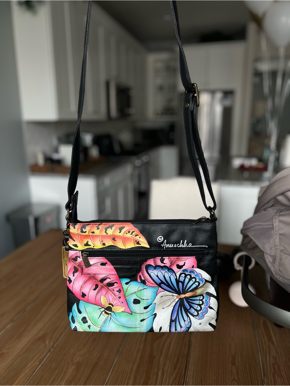 Anuschka Black Leather Crossbody with Multicolor Butterfly and Tropical Leaves